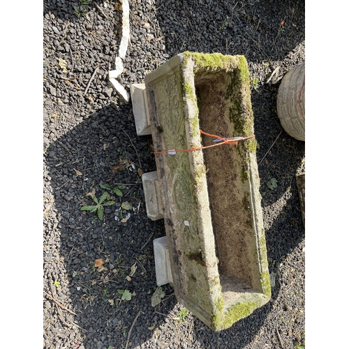 18 - A RECTANGULAR CONCRETE PLANTER, with three supports, 65cm long