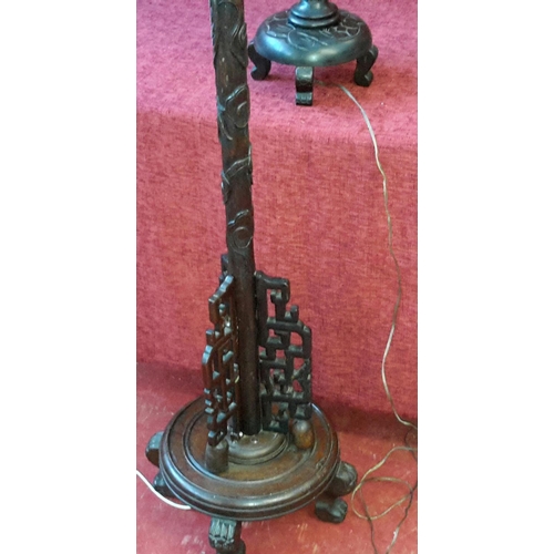 137 - A solid mahogany carved dragon standard lamp, together with small matching side table lamp (both wor... 