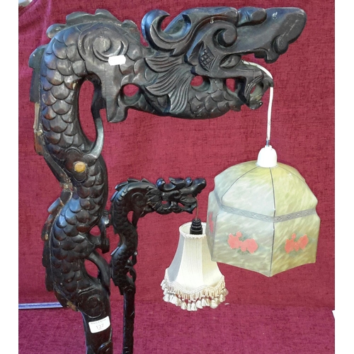 137 - A solid mahogany carved dragon standard lamp, together with small matching side table lamp (both wor... 