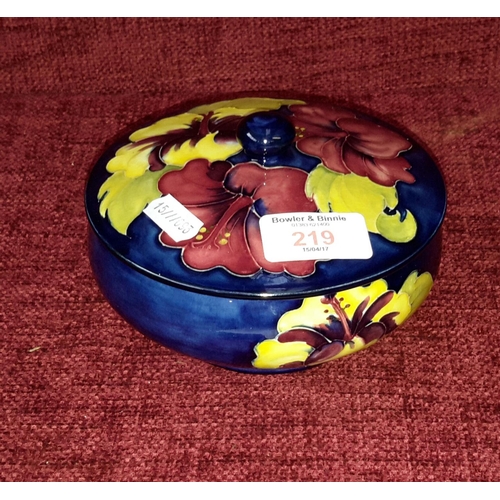 219 - William Moorcroft Hibiscus lidded bowl in cobalt blue, with 'The Late Queen Mary' sticker to base (p... 