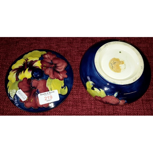 219 - William Moorcroft Hibiscus lidded bowl in cobalt blue, with 'The Late Queen Mary' sticker to base (p... 