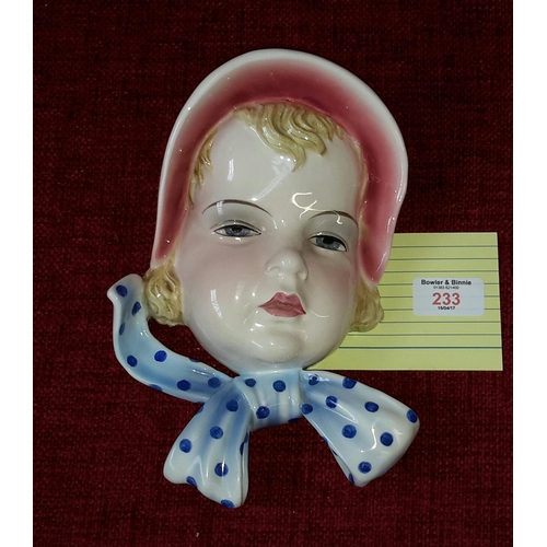 233 - Rare art deco Goldscheider Wien wall mask of young girl with a pink bonnet, signed Dakon to the bott... 