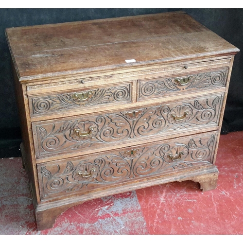 156 - Early Georgian oak 2 over 2 drawer chest with carved fronts, brass handles & pull out writing slope