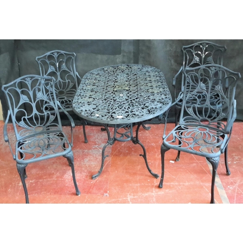 176 - Cast metal ornate garden table & 4 matching arm chairs