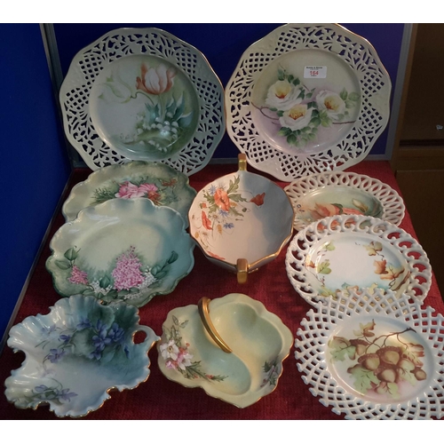 164 - A selection of hand painted pierced trim plates, bon bon dishes & 2 handled bowl with names such as ... 