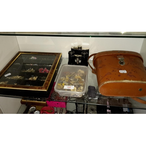 106 - Shelf of jewellery, badges & binoculars etc