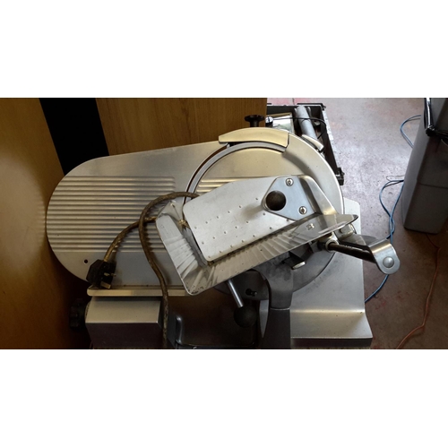 466 - Large industrial meat slicer working