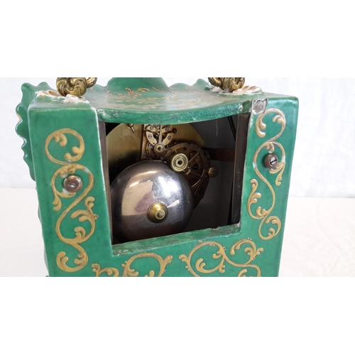 100 - Henry Marc Paris clock in its gilted porcelain casing, has hand painted couple scene, green and gilt... 