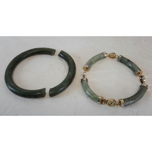 131 - 2 jade bangles (one damaged)