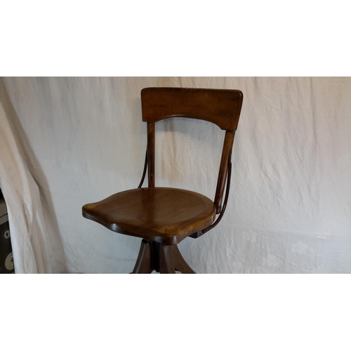 402 - Edward VII rise & fall shop chair stamped C.G, 92cm in height