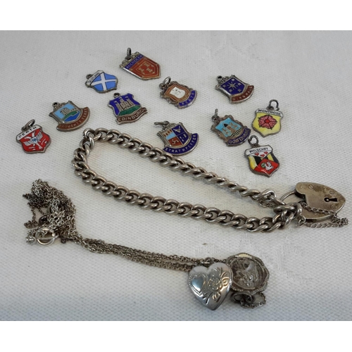 56 - A silver curb bracelet, silver and enamel souvenir charms and 2 other silver items