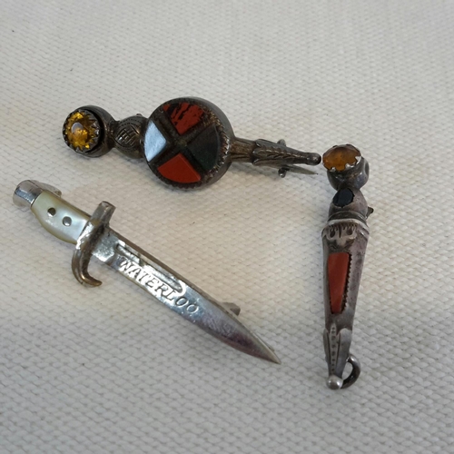 58 - 2 silver and agate brooches together with dagger brooch. Longest is 4cm