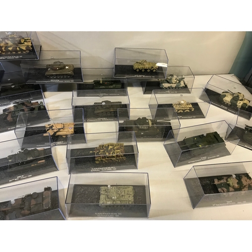 468 - Collection of 24 die cast model tanks all with protective casings