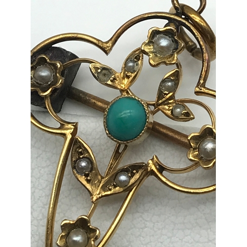 30 - A 9ct gold Art Nouveau pendant/ brooch set with 2 turquoise stones and seed pearls.