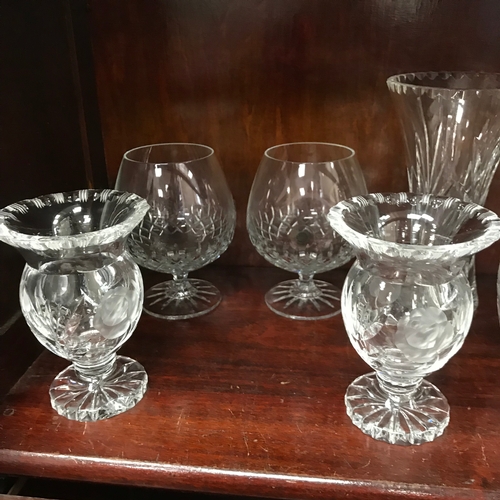 90 - A Shelf of various crystal glasses and vases.