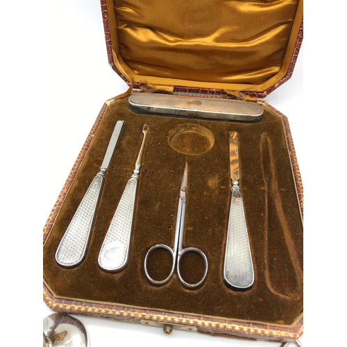 252 - A Lot of various silver hall marked items includes Part Manicure set, Various silver handled shoe ho... 