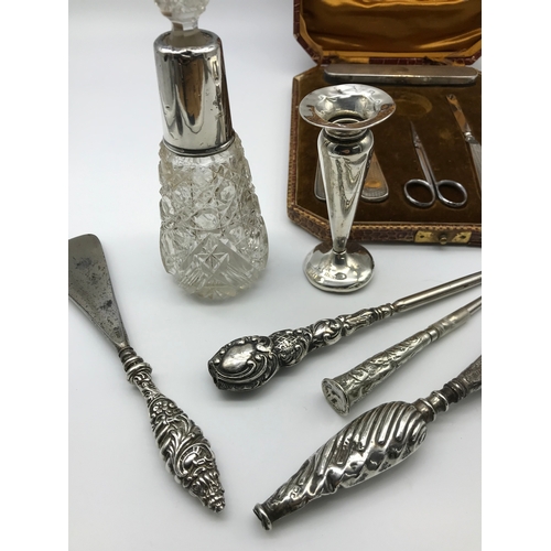 252 - A Lot of various silver hall marked items includes Part Manicure set, Various silver handled shoe ho... 