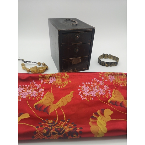 283 - A mixed oriental lot to include, a yellow jade bracelet, a silk tapestry cover, a lacquered oriental... 