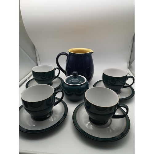 305 - A 9 piece Denby tea set in a blue-green colour together with a Denby jug in dark blue