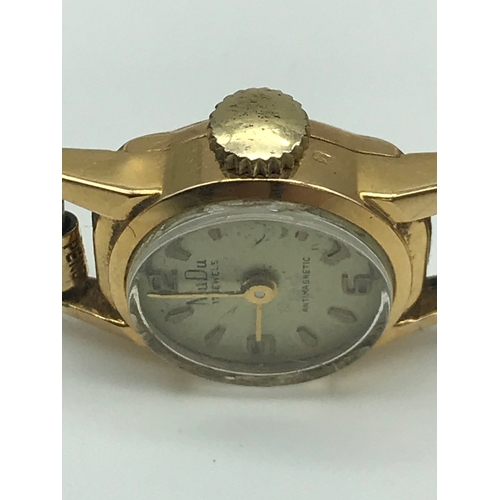 9 - Vintage Swiss made MuDu ladies 18K Gold cased watch with gilt metal strap. 17 jewels. Non running.