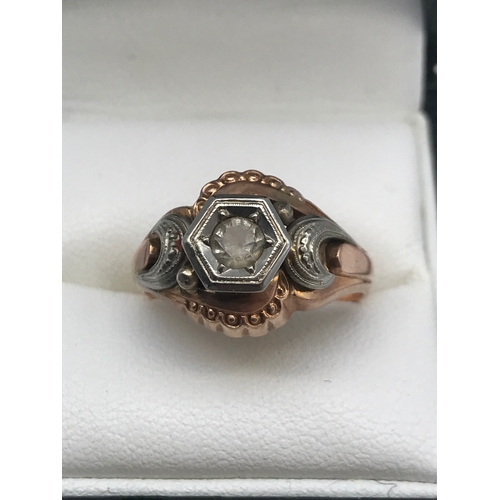 17 - An Antique gold and white metal gents ring, designed with a single clear stone, Ring size P, Stamped... 