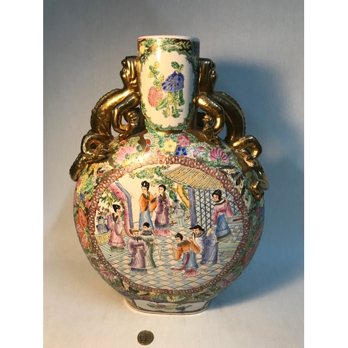 296 - A Mid 20th century Famille rose moon flask detailed with gilt painted dragon handles. Measures 41cm ... 