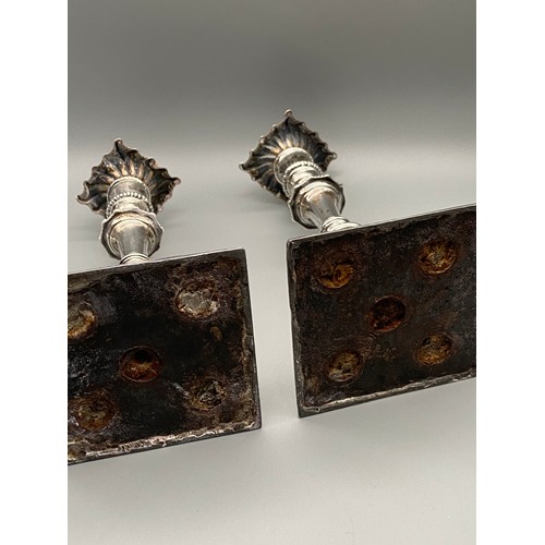 157J - A Pair of ornate London silver candle sticks made by Johnson Walker & Tolhurst. Dated 1909. [16cm he... 