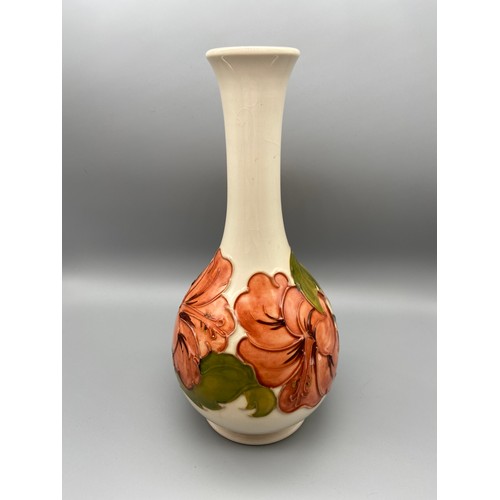 3A - A Vintage Moorcroft vase detailing a tubelined Hibiscus flower design. Impressed to the base and Sig... 