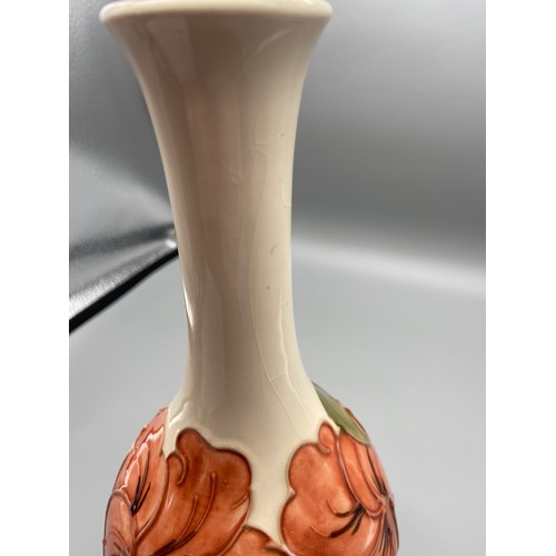 3A - A Vintage Moorcroft vase detailing a tubelined Hibiscus flower design. Impressed to the base and Sig... 