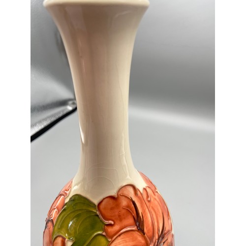 3A - A Vintage Moorcroft vase detailing a tubelined Hibiscus flower design. Impressed to the base and Sig... 