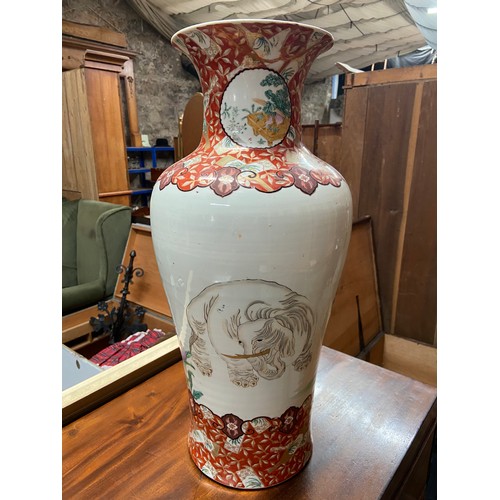 95A - A 19th century Japanese hand painted urn style vase. Depicts a large elephant reverse side detailing... 