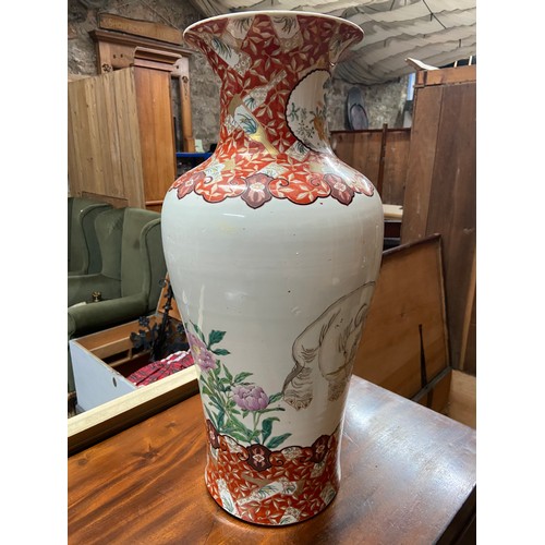 95A - A 19th century Japanese hand painted urn style vase. Depicts a large elephant reverse side detailing... 