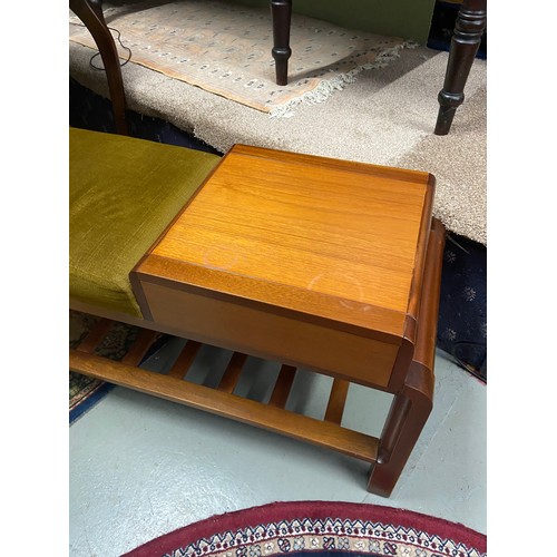 67A - A Mid century teak telephone table with green material cushion seat area. Single pull out drawer and... 