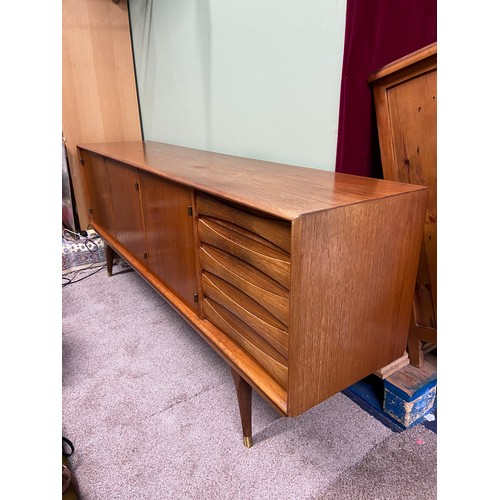 76A - A Very Stylish Retro teak mid century pedestal sideboard, designed with 5 drawers and three doors. C... 