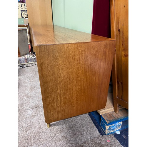 76A - A Very Stylish Retro teak mid century pedestal sideboard, designed with 5 drawers and three doors. C... 