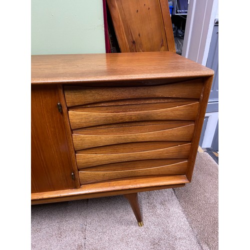 76A - A Very Stylish Retro teak mid century pedestal sideboard, designed with 5 drawers and three doors. C... 