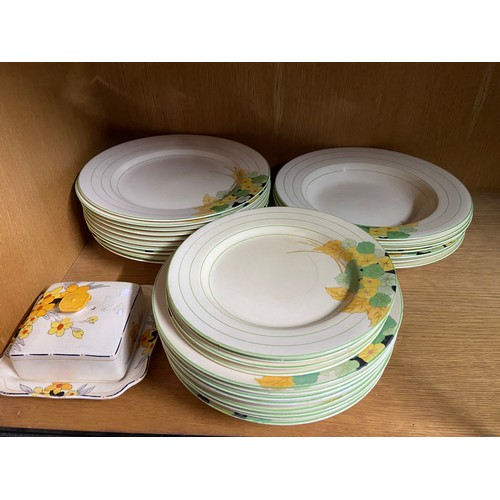 81A - A Collection of Crown Ducal art deco style dinner plates and bowls together with a Crown ducal butte... 