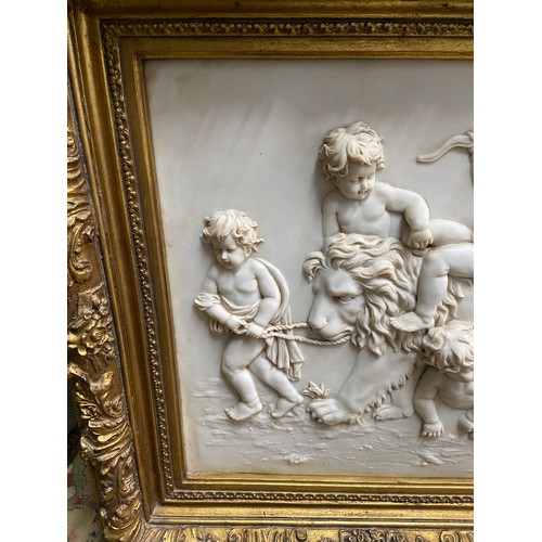 97A - A Large 20th century marble plaque featuring relief carvings of Cherubs Whimsically riding a Lion. F... 