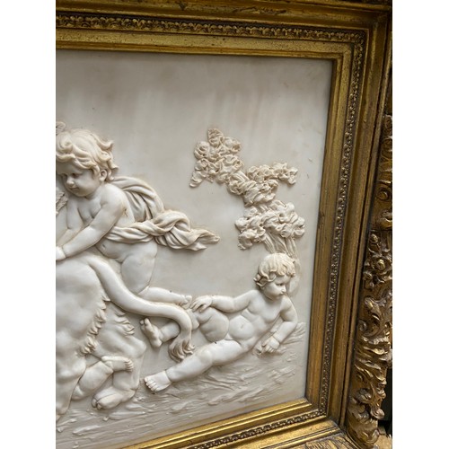 97A - A Large 20th century marble plaque featuring relief carvings of Cherubs Whimsically riding a Lion. F... 