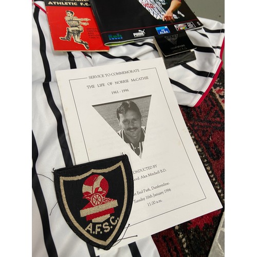 105A - A Dunfermline Football Club signed shirt with various football programmes, Scarf and glass tankard.