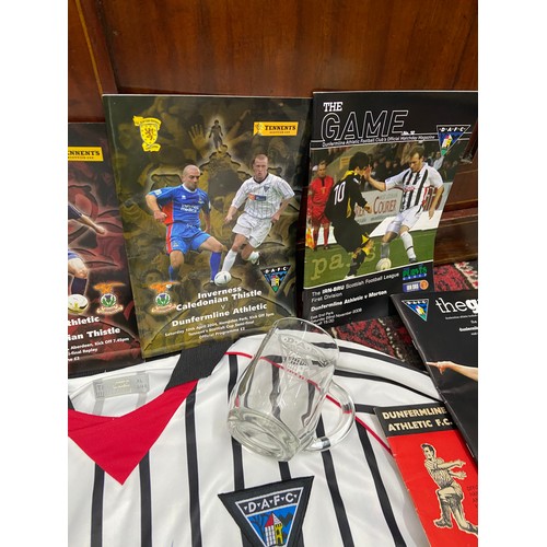 105A - A Dunfermline Football Club signed shirt with various football programmes, Scarf and glass tankard.