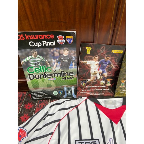 105A - A Dunfermline Football Club signed shirt with various football programmes, Scarf and glass tankard.