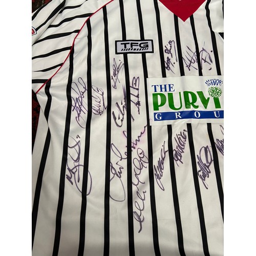 105A - A Dunfermline Football Club signed shirt with various football programmes, Scarf and glass tankard.