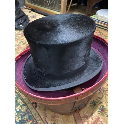 130A - A Gentleman's Black silk Top Hat produced by Austin Reed Ltd. Regent St. London. Complete with a lea... 