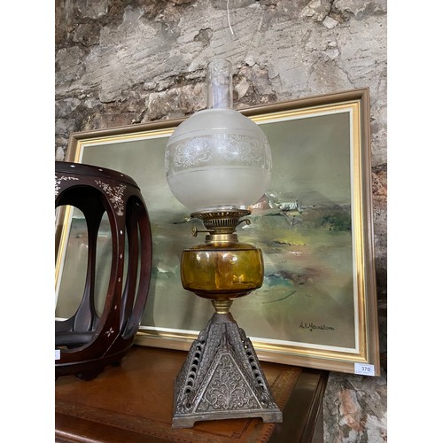 431B - A 19th century cast metal, amber glass and frost glass shade paraffin lamp.