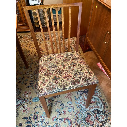 155 - A mid century teak table, together with 6 chairs produced by Oliver Melville & Co Kirkcaldy.