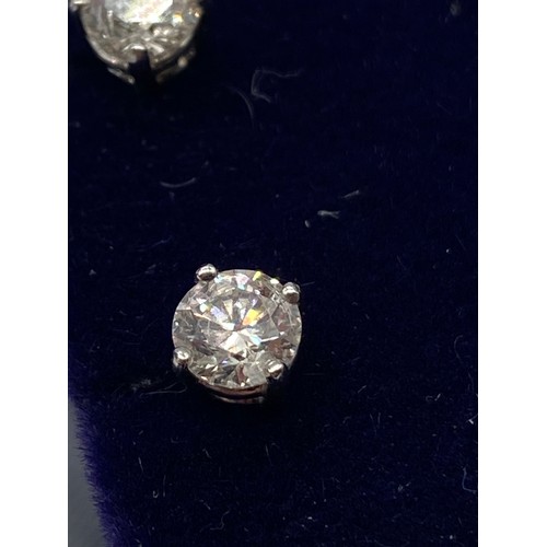 68 - A Beautiful pair of 14ct white gold diamond stud earrings of 75 points. [0.88ct in total]