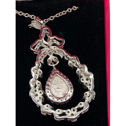 64 - A Beautiful example of a ladies 925 silver, cz and pear shaped opal pendant with necklace.