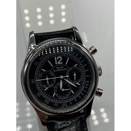 60 - A Gents 25 jewel wrist watch bearing the name Daniel Jean Richard, designed with a leather strap. In... 