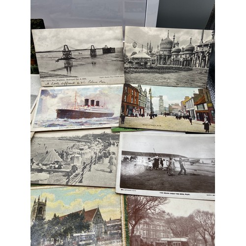 133 - A Large quantity of vintage postcards which includes the forth rail bridge and various harbours and ... 